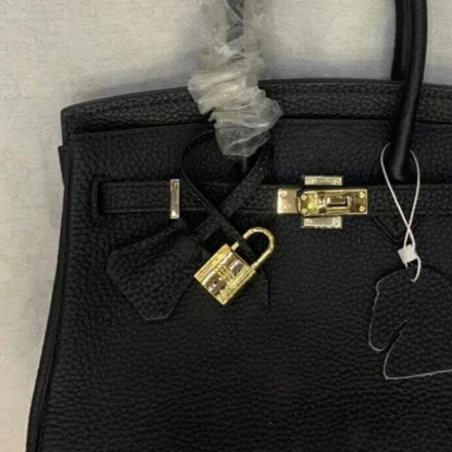 Tasche 25 Brk mit Goldbeschlägen in Schwarz