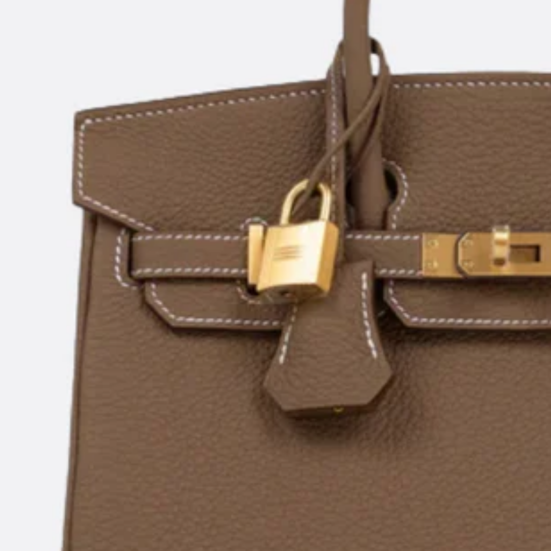 Tasche 25 Brk HSS Cr / GryTr aus Tg-Leder mit gebürsteten Goldbeschlägen